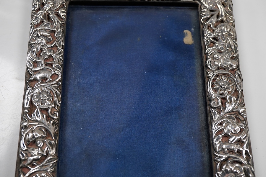 A George V repousse silver mounted rectangular photograph frame, maker's mark rubbed, London, 1911, 18.3cm.